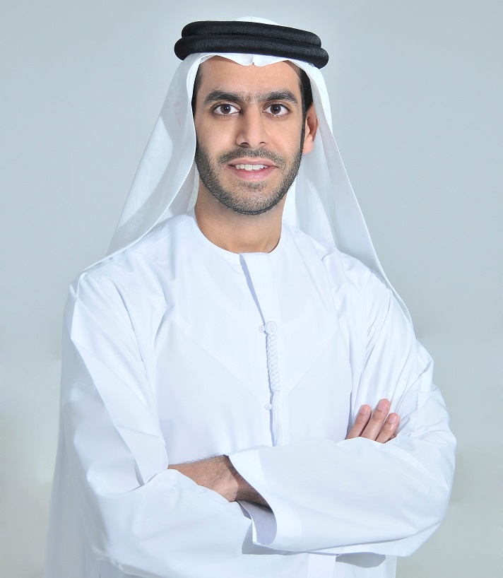 Marwan Al Sarkal standing with his arms crossed in traditional Emirati dress